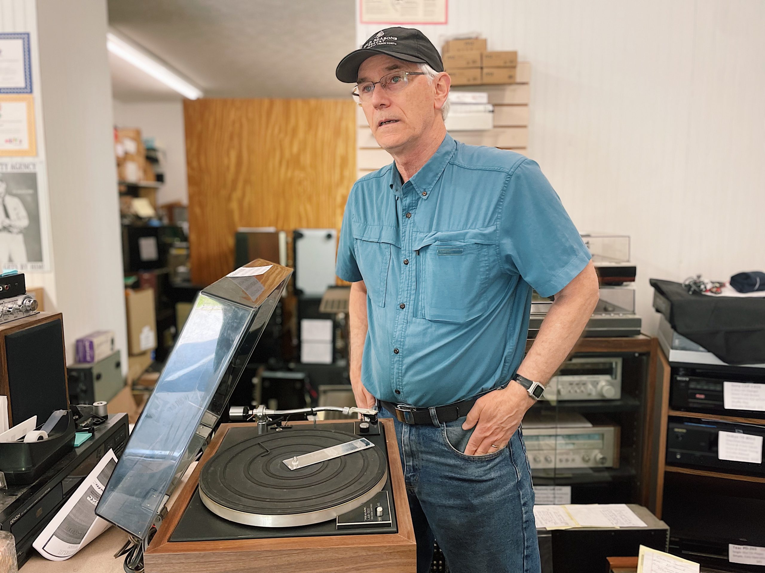 Loyal Lawrence, founder of Audio Service Inc., works on a vintage turntable. 