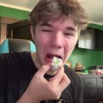 A person accidentally eating a ball of wasabi.