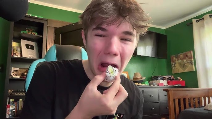 A person accidentally eating a ball of wasabi.